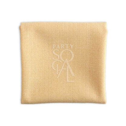 Close-up of a linen blend napkin, ideal for events. Available in various colors, sizes: Cocktail Napkin (25cm L x 25cm W) and Dinner Napkin (50cm L x 50cm W). From Party Social. Napkins from Party Social Dubai.