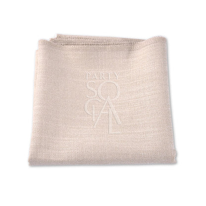 A folded linen blend napkin, ideal for events. Elevate your table setting with premium napkins in various colors. Perfect for weddings, dinners, and special occasions. Dimensions: 50cm L x 50cm W. Napkins from Party Social Dubai.