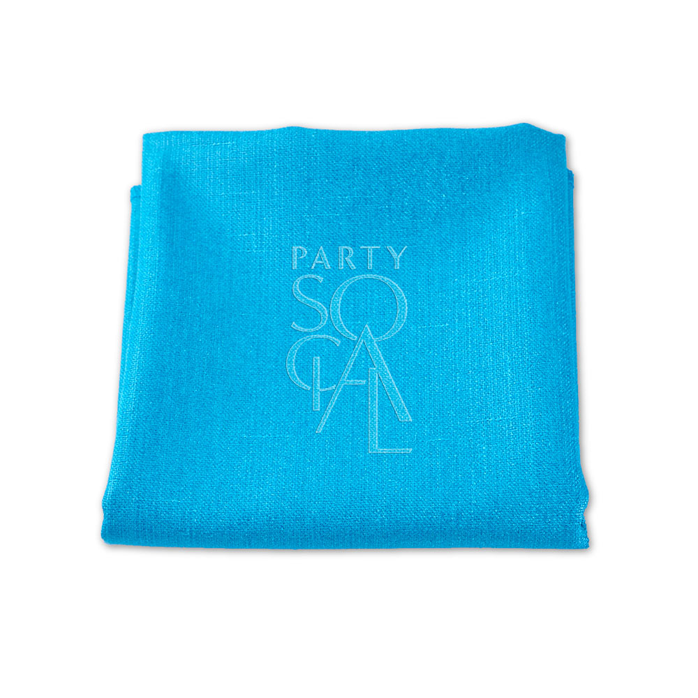 Folded blue linen blend napkin by Party Social. Elevate your table setting with premium napkins for any event. Available in various sizes. Starting at 48 AED. Napkins from Party Social Dubai.