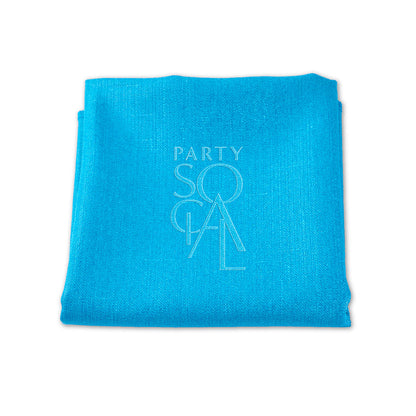 Folded blue linen blend napkin by Party Social. Elevate your table setting with premium napkins for any event. Available in various sizes. Starting at 48 AED. Napkins from Party Social Dubai.