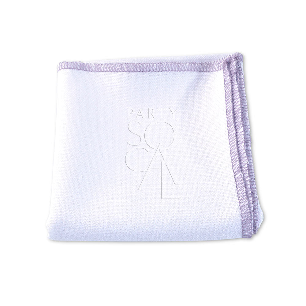 A premium linen blend napkin with purple trim, perfect for adding elegance to any event. Available in various colors. Ideal for weddings, dinner parties, and special occasions. Dimensions: 50cm L x 50cm W. Napkins from Party Social Dubai.