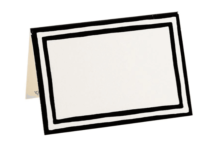A black and white rectangular sign with a die-cut design, perfect for place cards and labeling at events.