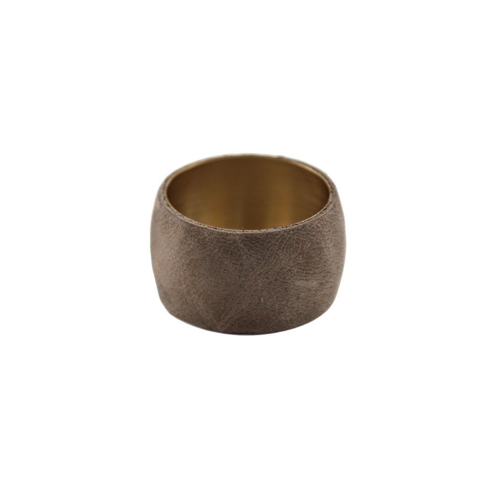 Leather wrap napkin ring with gold rim and hole detail.