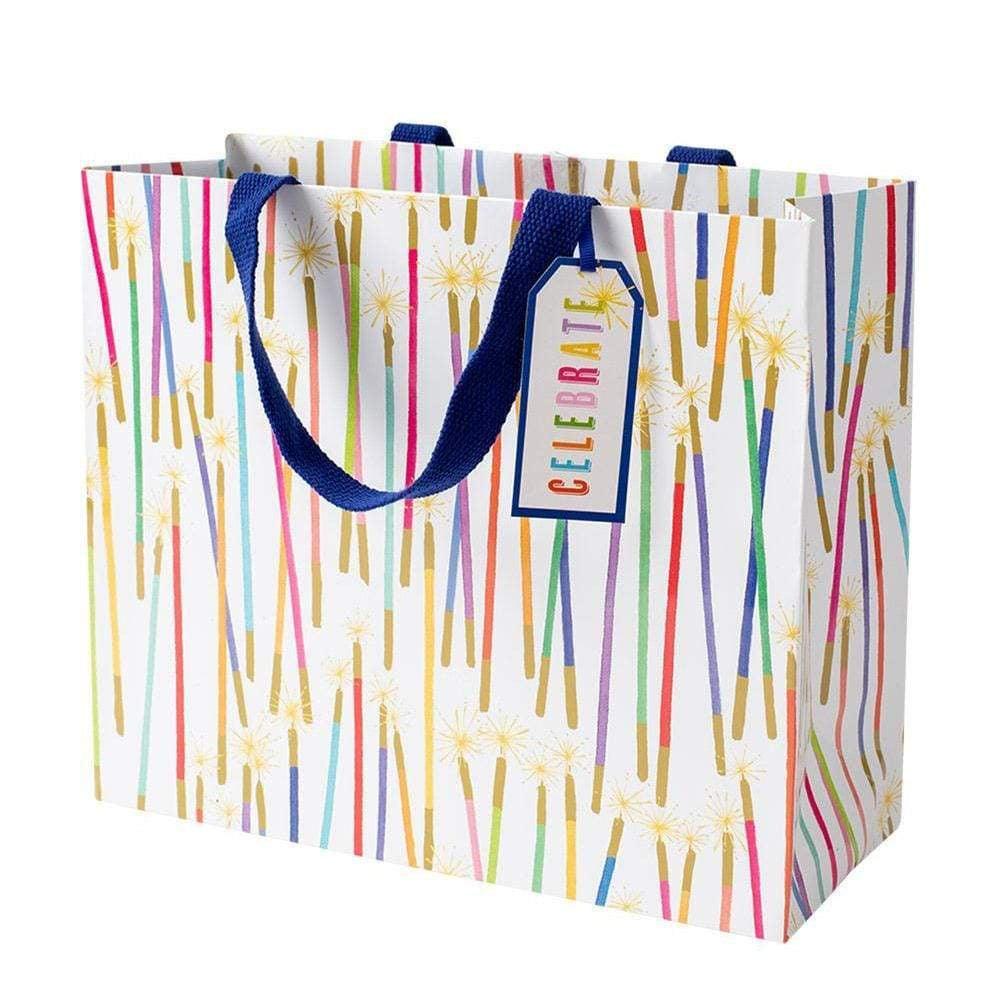 A durable gift bag with strong handles, featuring a pattern of fireworks and a close-up of a candle. Perfect for presenting your Party Candles.