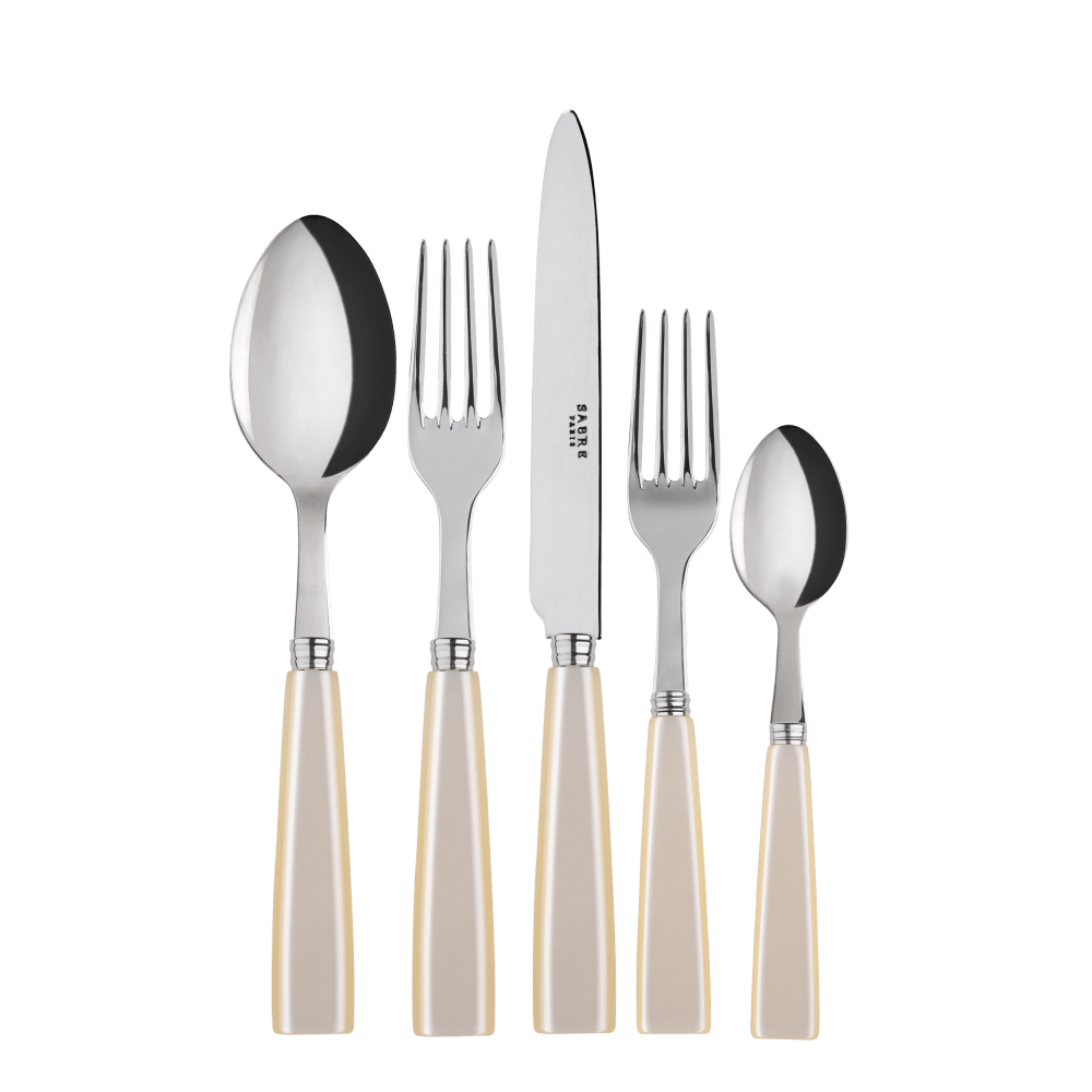 Pearl Cutlery Set of 5: Close-up of stylish silverware with white handles, including knives, perfect for elevating any table setup.