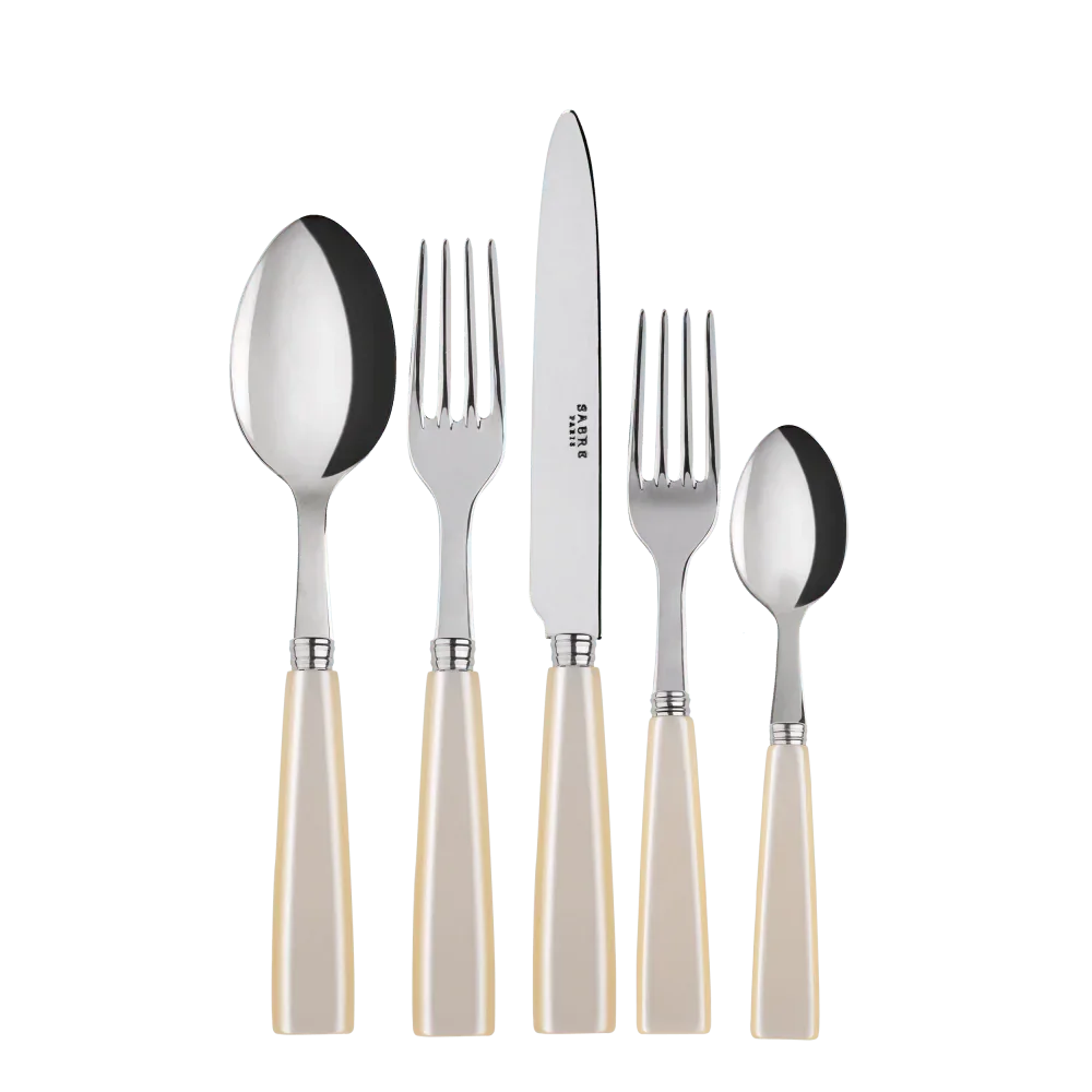 Pearl Cutlery Set of 5: Close-up of stylish silverware with white handles, including knives, perfect for elevating any table setup.