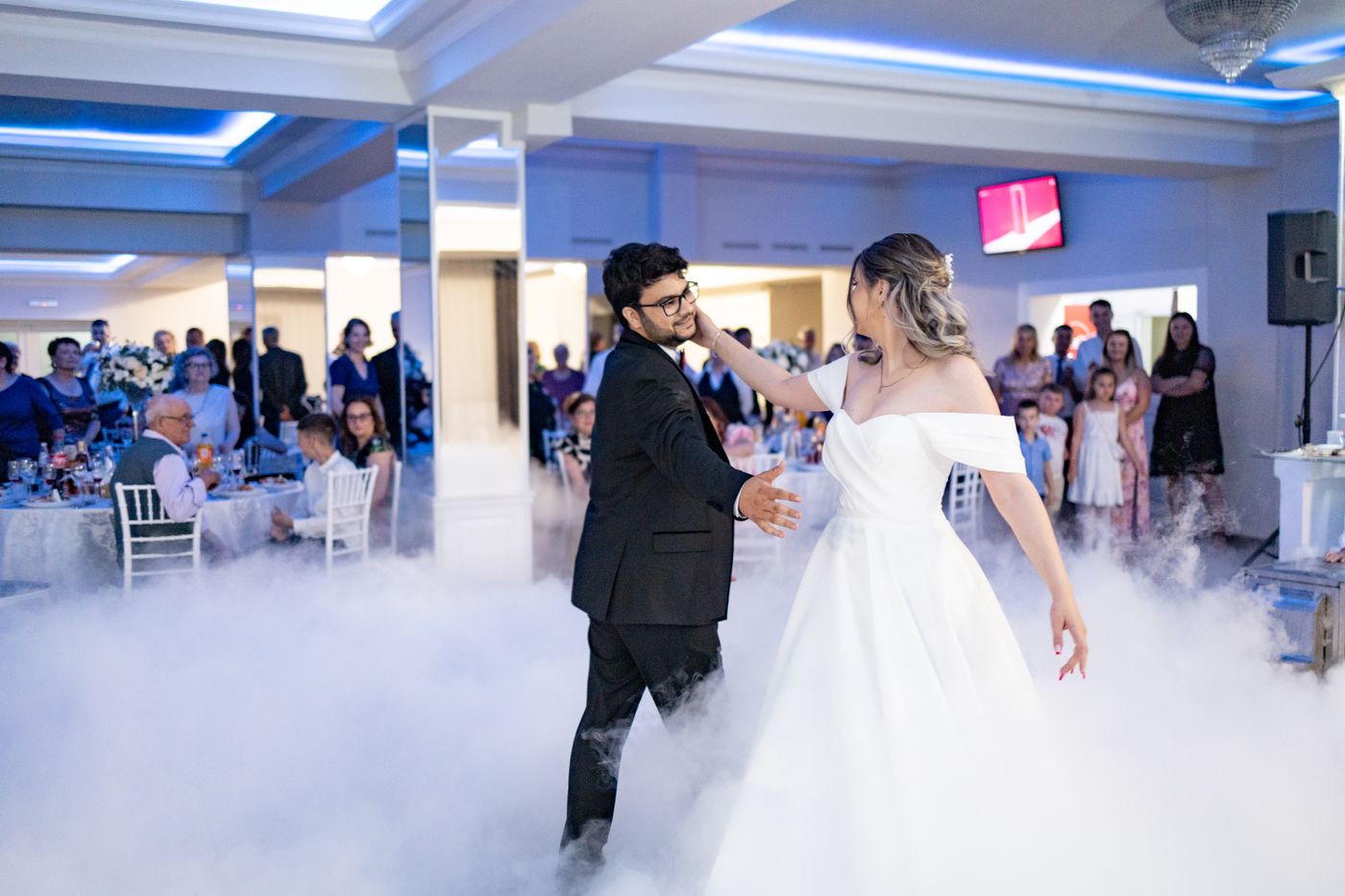A couple sharing their first dance at a wedding reception